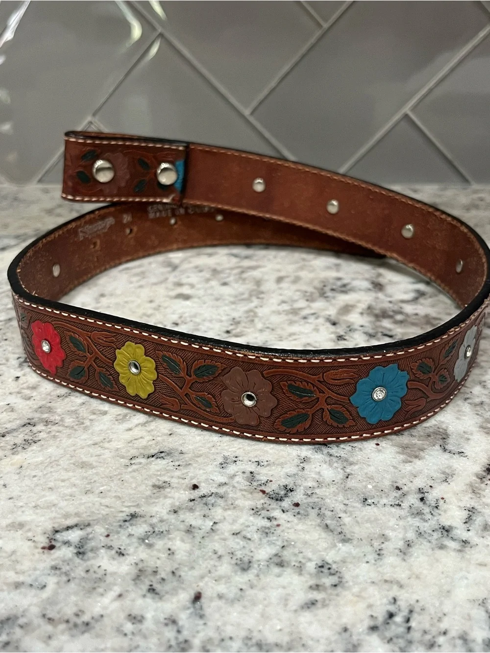 Nocona genuine leather tooled belt size 24- measures 28 3/4”